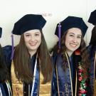Four female graduates of the law school pose